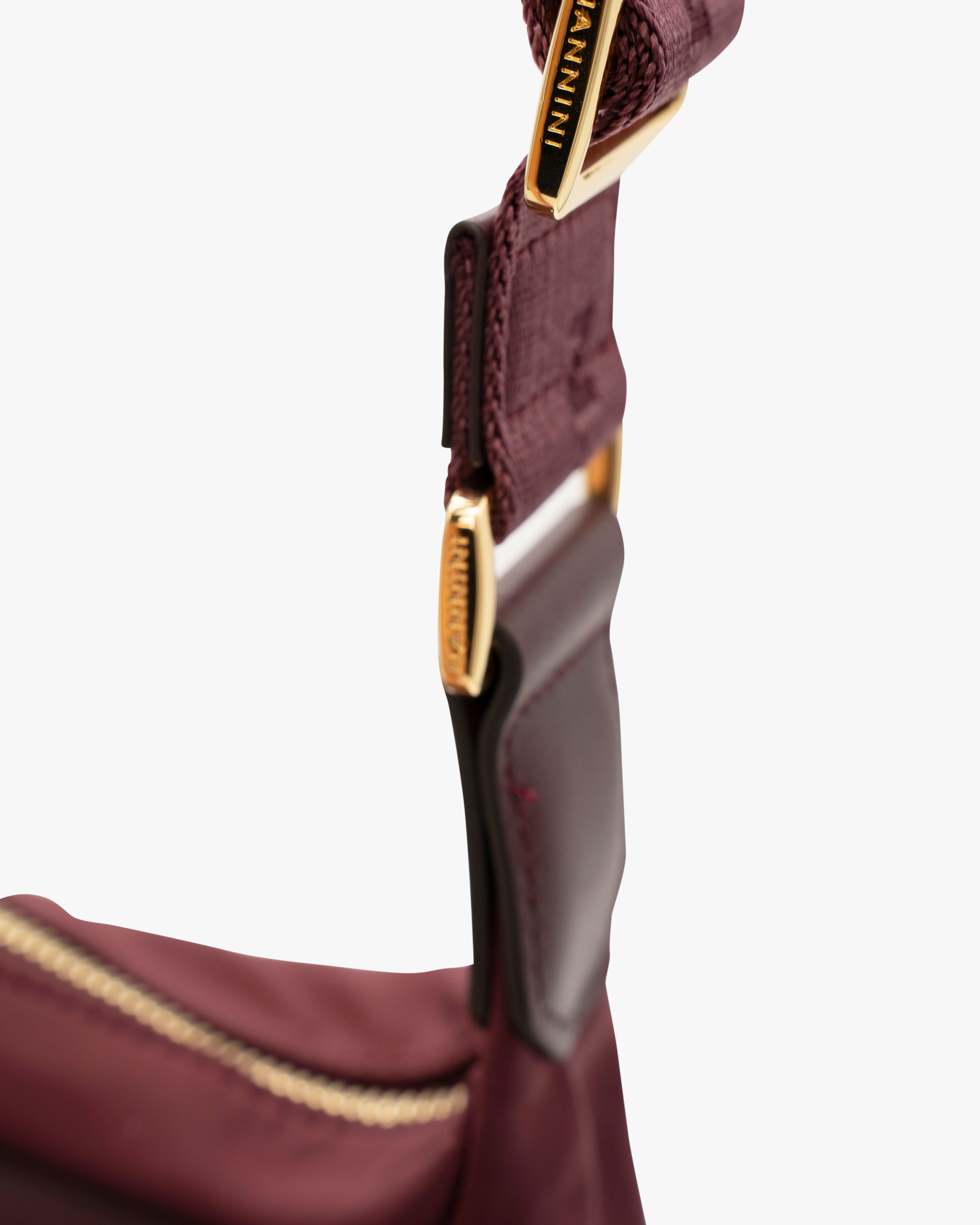 NANNINI tracolla semirigida pelle martellata verde chiaro spalla